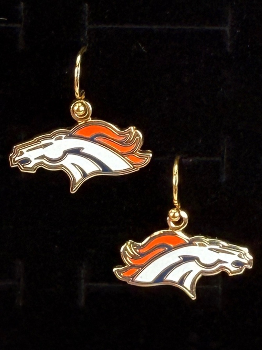 Goldtone, orange and white wild horse Mustang pierced earrings